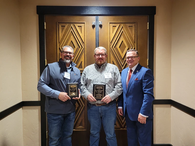 Ag Excellence Award winners holding plaques 