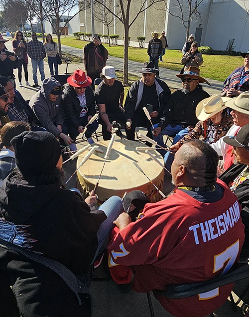 Choinumni tribe beating drum