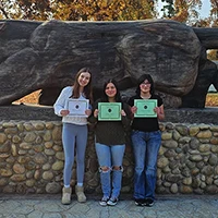 Three honors students with awards