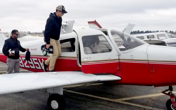 Student Climbing into Cockpit